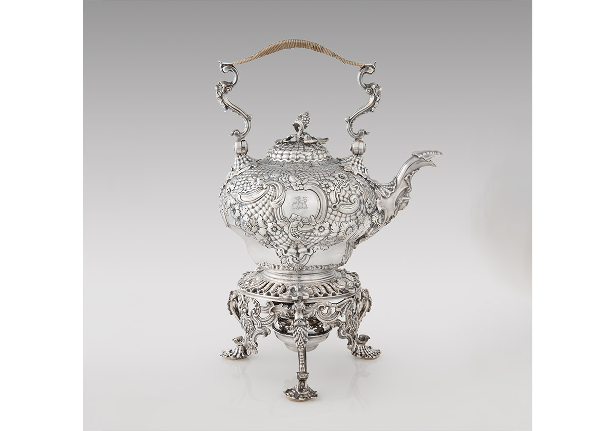 A Rococo silver teakettle.